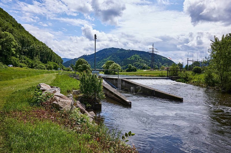 River Kinzig, weir, hydroelectric power plant power station, power generation, transformer station, bank with trees and meadow, hilly landscape with coniferous forest, blue sky with cumulus clouds, Hammerwehr, Hausach, Black Forest, Ortenaukreis, Baden-Württemberg, Germany, Europe