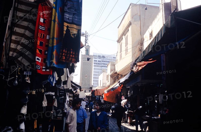 People shopping in the shady dark alleys of the souq market, Casablanca, Morocco, North Africa, Africa