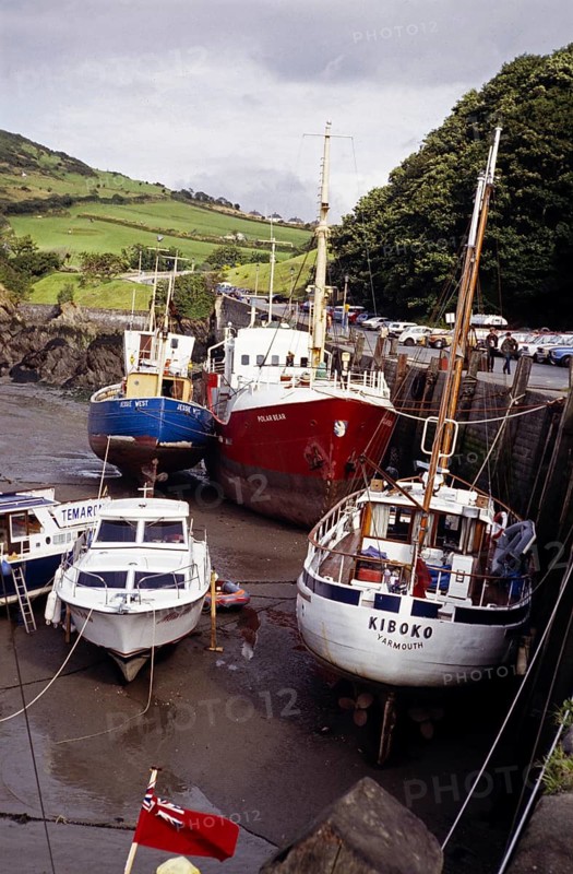 Boats in the harbour at low tide, Ilfracombe, North Devon, England, UK 1970s yacht Kiboko, registered in Yarmouth