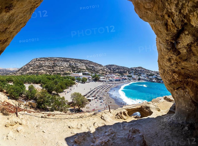 View from the rock caves to the beach of Matala, south coast, Crete, Greece, Europe