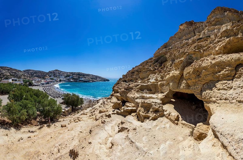 View from the rock caves to the beach of Matala, south coast, Crete, Greece, Europe