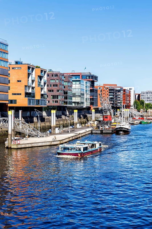 Building in the HafenCity Sandtorhafen harbour with boats in Hamburg, Germany, Europe