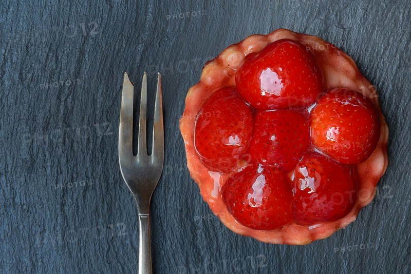 Topped strawberry tartlet with fork