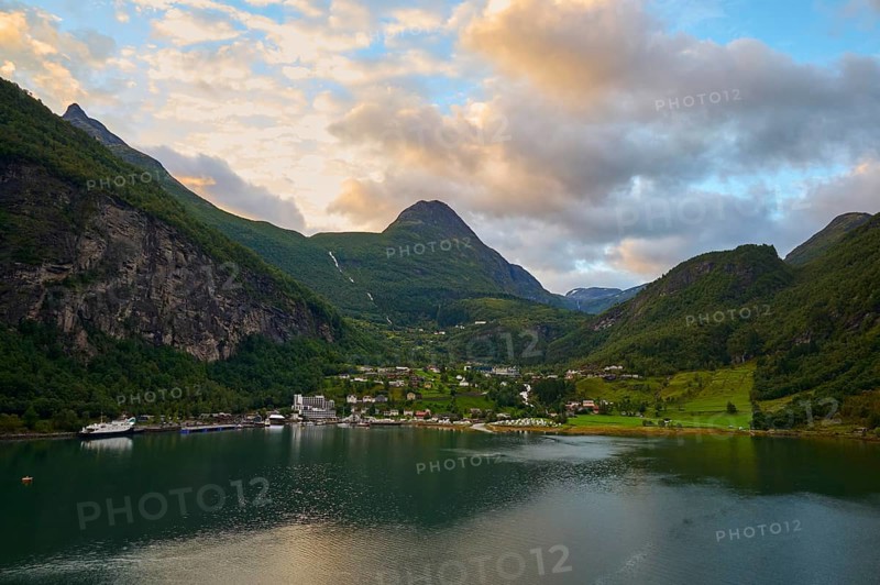 Geiranger with fjord landscape with mountains embedded in nature, covered by dramatic clouds, Geiranger, Geiranger Fjord, Stranda, Romsdal, Norway, Europe