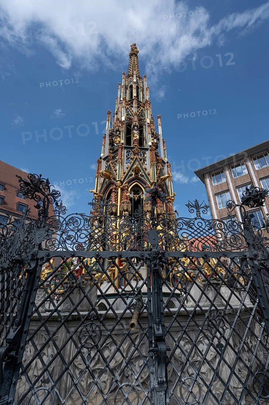 The 19 metre high Schöne Brunnen fountain on the Hauptmarkt is a copy made of shell limestone in 1903, the surviving remains of the original stone fountain can be found in the Germanisches National Museum, Hauptmarkt, Nuremberg, Middle Franconia, Bavaria, Germany, Europe