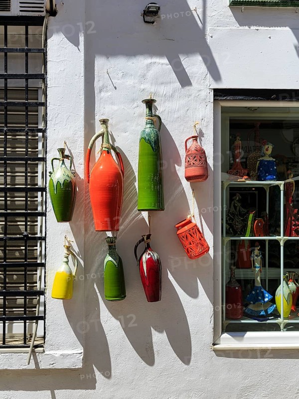 Handicrafts, colourful vases, jugs hanging from the facade, souvenir shop in the old town of Cordoba, Córdoba, Andalusia, Spain, Europe