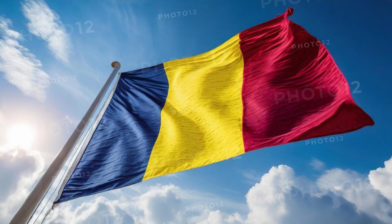 Flags, the national flag of Chad flutters in the wind