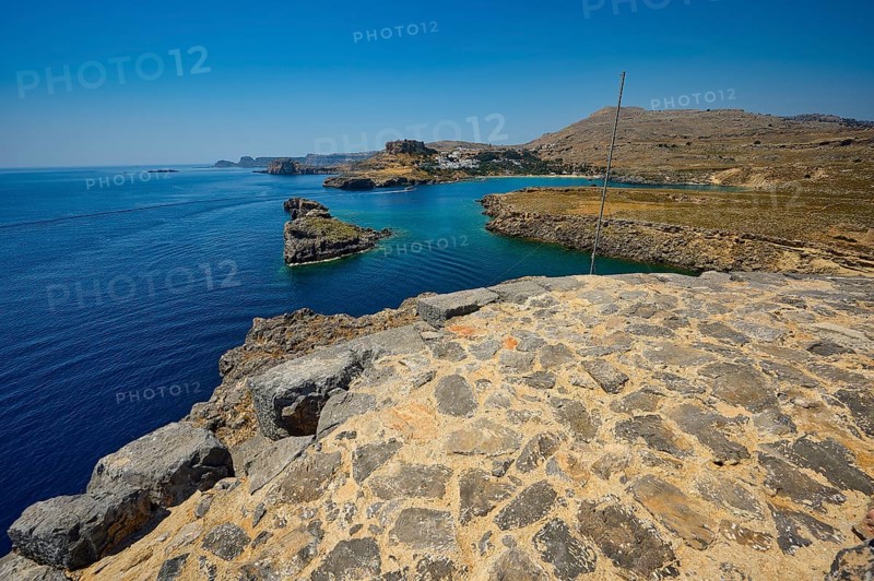 Extensive view of the blue sea and the rocky coast on a clear day, tomb of Cleovoulos the Lindier, ruins, near Lindos, Lindos, Rhodes, Dodecanese, Greek Islands, Greece, Europe