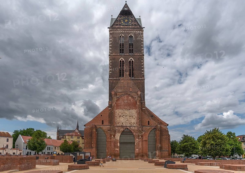 Remaining tower of St Mary's Church, built from 1260-70, in front the bases of the pillars of the former nave of the church, St Mary's Churchyard, Wismar, Mecklenburg-Western Pomerania, Germany, Europe