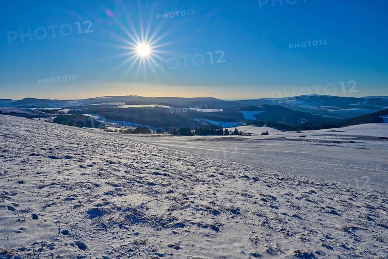 Hilly, snow-covered landscape under bright sun and blue sky, winter, Wasserkuppe, Gersfeld, Rhön, Hesse, Germany, Europe