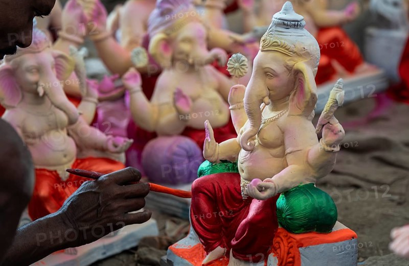 An artisan decorates an idol of the elephant-headed Hindu deity Ganesha at a workshop ahead of the Ganesh Chaturthi festival on September 5, 2024 in Guwahati, Assam, India, Asia