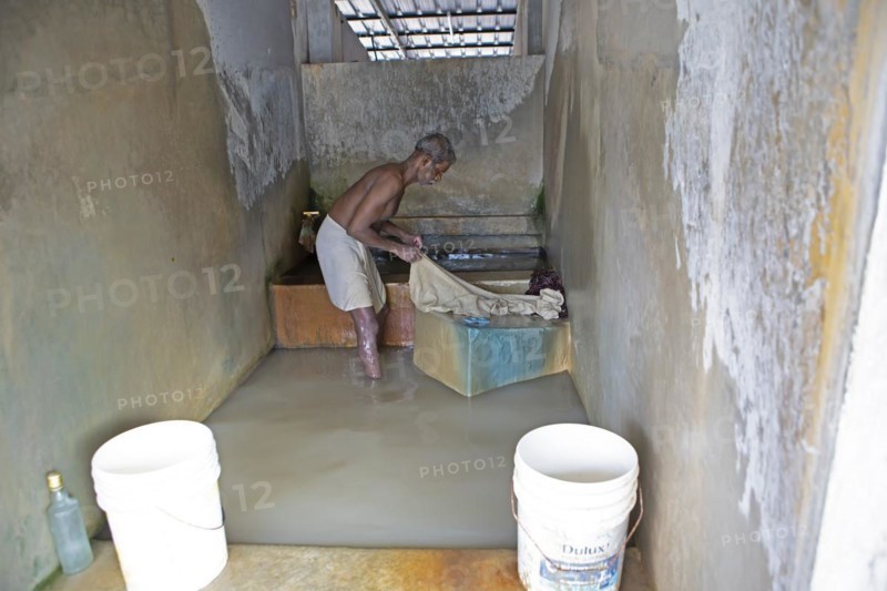 Indian man, 63 years old, washing clothes at the Dhoby Khana laundry, Kochi, Kerala, India, Asia
