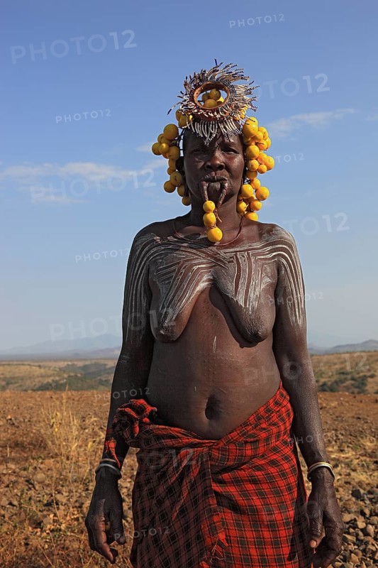 South Ethiopia, in the Maco National Park, woman from the Mursi tribe, Mursi woman with naked upper body and painted skin, Ethiopia, Africa
