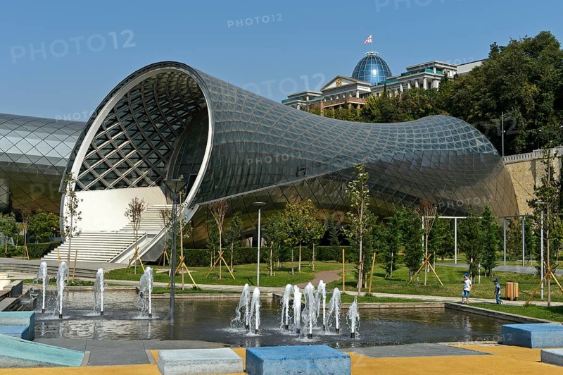 Futuristic theatre building and exhibition hall in Rike City Park, architect Studio Fuksas, behind the Palace of Georgia, formerly the Presidential Palace, Tbilisi, Georgia, Asia