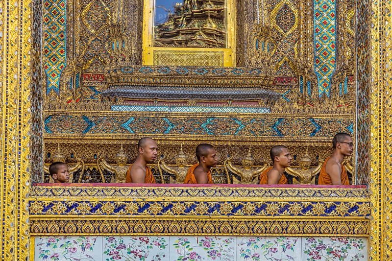 Wat Phra Kaeo temple, royal palace. Royal chapel with Buddhist monks and novices. Bangkok, Thailand, Asia