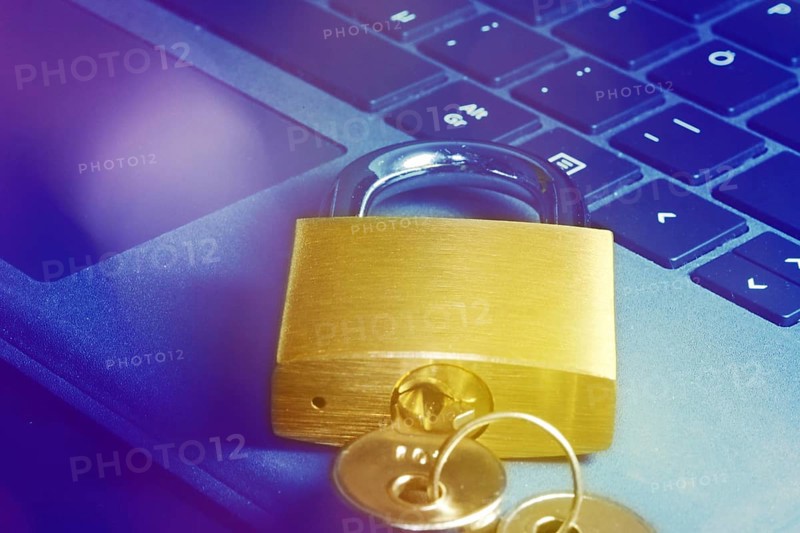 Padlock on a keyboard as a symbolic image for internet security, hacker attacks and so on