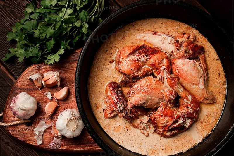 Shkmeruli, fried chicken, in milk-garlic sauce, Georgian cuisine, homemade, close-up, no people