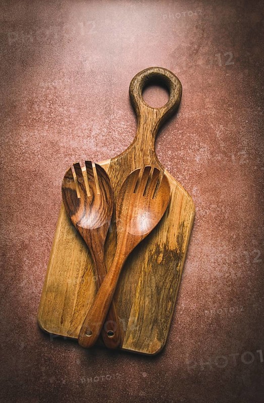 Wooden spoon, with cloves, for salad, two pieces, natural wood, with cutting board, food background, wallpaper, top view