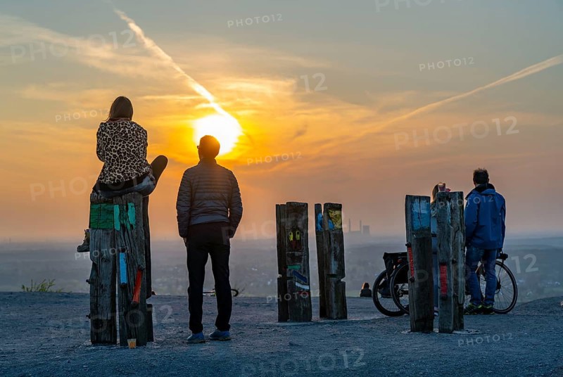 The Haniel spoil tip, 185 metre high spoil tip, at the Prosper Haniel mine, which was closed in 2019, artwork Totems by the sculptor Augustin Ibarrola, sunset, Bottrop, Germany, Europe