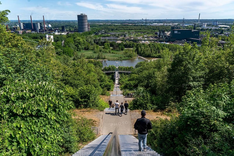 Descent, ascent via the stairs to the slagheap at Beckstrasse, Tetraeder slagheap, view of the Prosper coking plant, hiker, walker, Bottrop, Germany, Europe