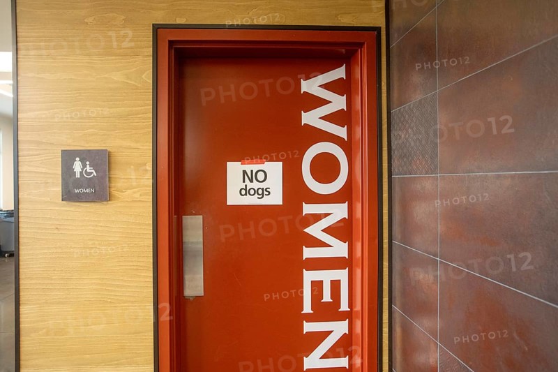 Oklahoma City, Oklahoma, Things are not always as they seem. A 'no dogs' sign on the women's restroom at the Canadian County Expo Center is not an insulting term for an ugly woman. Rather, it is an instruction to participants in a dog show at the center