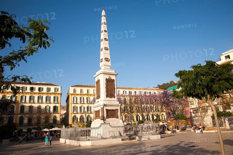 People enjoying a sunny spring afternoon in Plaza de la Merced, Malaga Spain