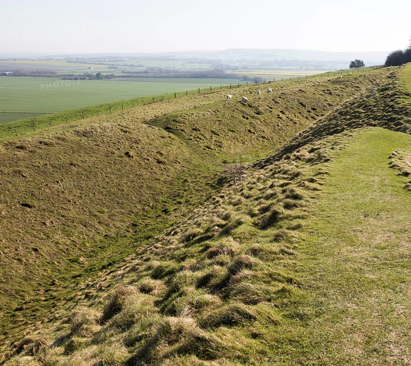 Defensive ditch and rampart at Barbury Castle Country Park, Iron Age hill fort, Wiltshire, England, UK