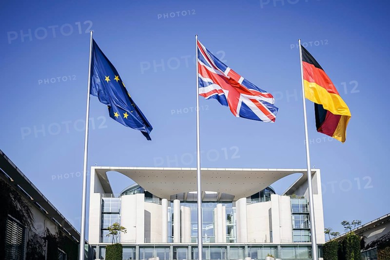 The flags of Europe, the United Kingdom of Great Britain and Northern Ireland and the Federal Republic of Germany wave in the wind in front of the Federal Chancellery in Berlin, on the occasion of the visit of the Prime Minister of the United Kingdom of Great Britain, 28 August 2024