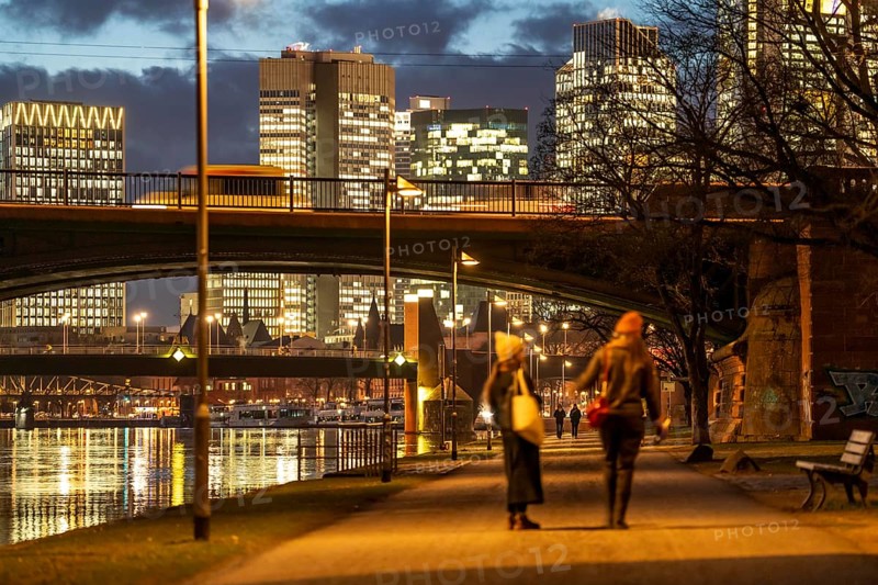 Skyline of the city centre of Frankfurt am Main, cycle and footpath, promenade, along the river Main, dusk, Hesse, Germany, Europe