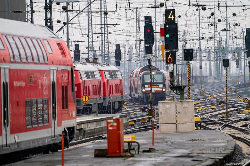 Railway tracks with regional trains, after freezing rain, in front of Frankfurt main station, skyline in the fog, Hesse, Germany, Europe