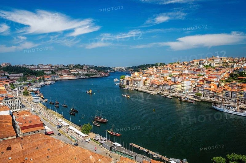 Aerial view of Porto city and Vila Nova de Gaia and Douro river with moored sailling ship from Dom Luis bridge I. Porto, Portugal, Europe