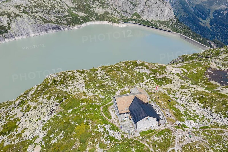 Capanna da l'Albigna, Albinga hut, above dam of reservoir Lake Albigna near village Vicosoprano, Bergell, Switzerland, Europe