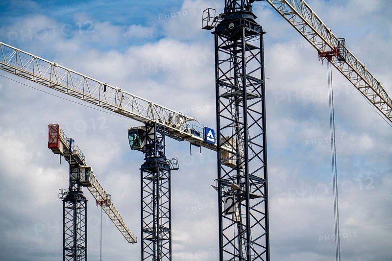 Construction cranes on two large construction sites, construction of office buildings in Dortmund-Schüren-Neu, North Rhine-Westphalia, Germany, Europe