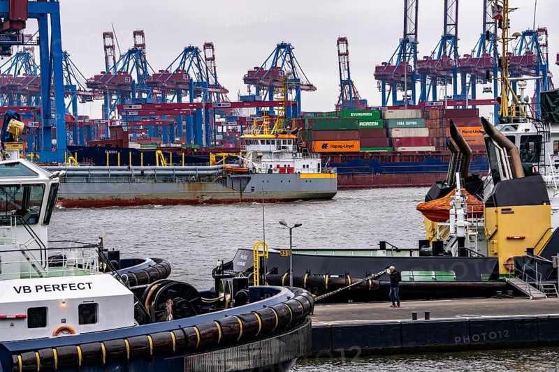 Port of Hamburg, HHLA Container Terminal Burchardkai, Athabaskakai, on the Elbe, container feeder ship Elbsky, harbour tug at the new tug bridge, Hamburg, Germany, Europe
