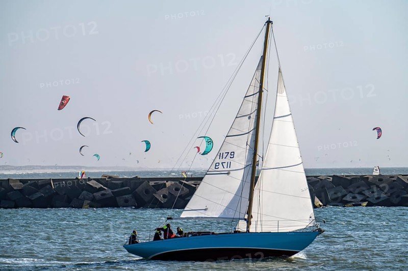 Sailing boat leaves the harbour of Scheveningen, Netherlands