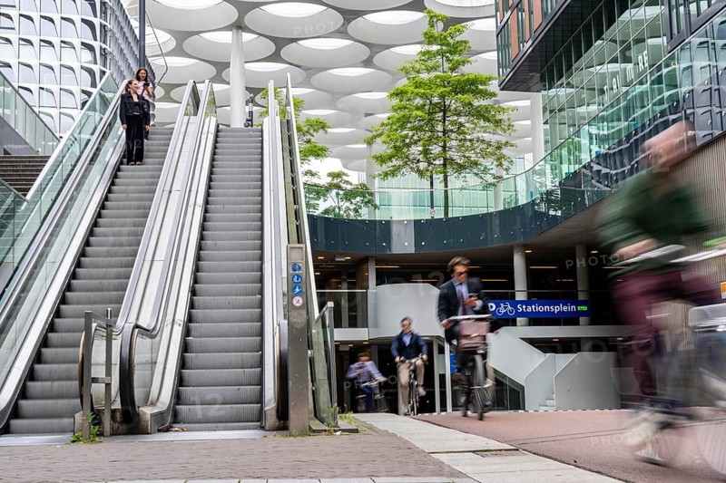 Entrance and exit of the bicycle car park at Utrecht Centraal station, Stationsplein, over 13, 000 parking spaces, considered the largest bicycle car park in the world, over 3 underground floors, Utrecht, Netherlands