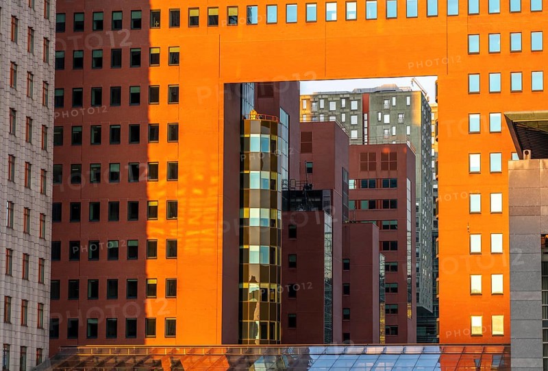View through the building of the public prosecutor's office, red, on Wilhelminaplein, on the Nieuwe Maas, Kop van Zuid, Rotterdam, Netherlands