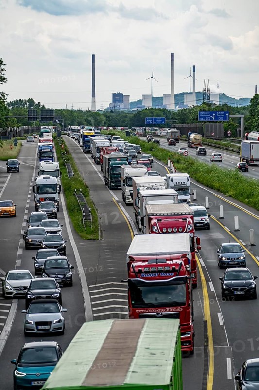 Traffic jam on the A2 motorway near Bottrop, behind the Bottrop motorway junction, in the direction of Oberhausen, due to a long-term construction site, renewal of the lanes, reduction of the lanes from 4, incl. access from the A31, to 2 lanes, daily traffic jam, in the background the UNIPER coal-fired power plant Gelsenkirchen Scholven, North Rhine-Westphalia, Germany, Europe