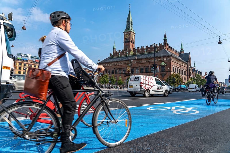 Cyclists on cycle paths, Radhuspladsen, City Hall Square, in the city centre of Copenhagen, considered the cycling capital of the world, 45 % of the inhabitants travel by bike, Denmark, Europe