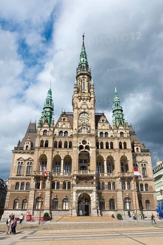 Gothic town hall with flags and clouds in the sky, an urban experience, Town hall, Liberec, Reichenberg, Bohemia, Czech Republic, Europe