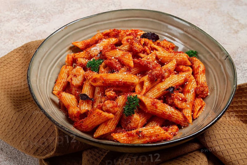 Penne pasta, with shrimp in tomato sauce, close-up, no people