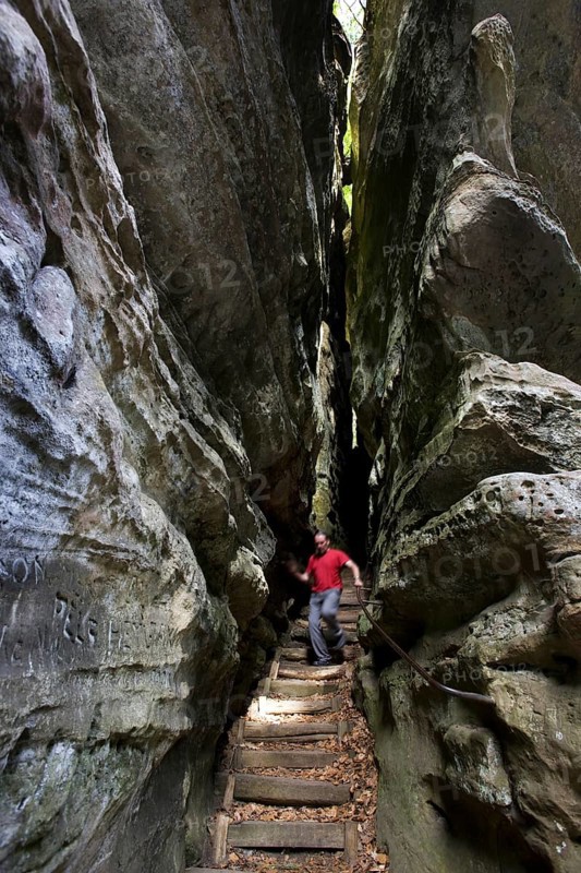 Trail with stairs leading through narrow gorge in the sandstone rock formation Perekop in Berdorf, Little Switzerland, Mullerthal, Grand Duchy of Luxembourg