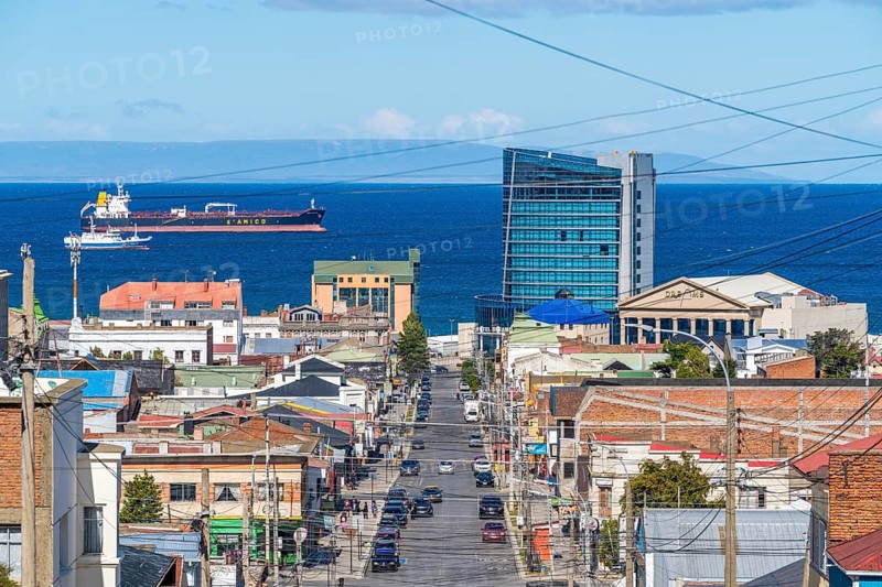 View from a hill over streets and houses to the Strait of Magellan, city of Punta Arenas, Patagonia, Chile, South America