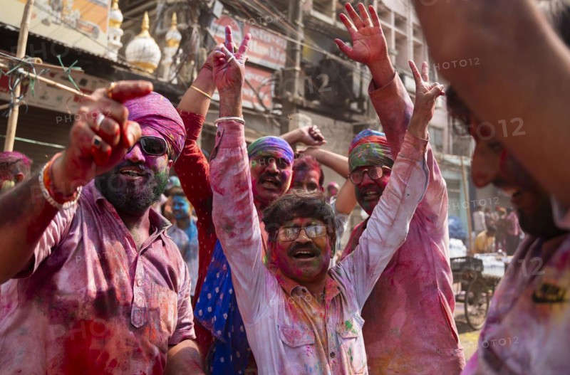 Revellers dancing in the beat of music as they celebrate Holi on a street, the Hindu spring festival of colours on March 25, 2024 in Guwahati, Assam, India. Holi, also known as the Festival of Colors or the Festival of Spring, is one of the most vibrant and joyous festivals in India