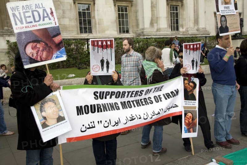 May Day march and rally at Trafalgar Square, London, England, UK May 1st, 2010 Silent protestors against regime in Iran