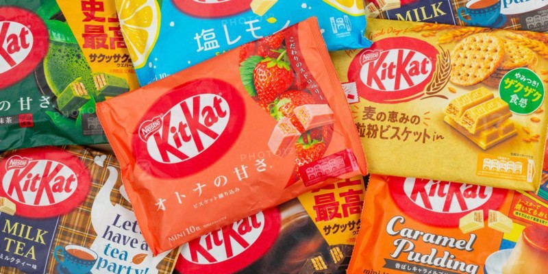 Different flavours of KitKat Kit Kat chocolate bar from Japan by Nestle as background panorama