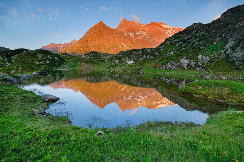 Chli Sustenhorn and Sustenhorn reflected in the Seebodensee, Canton Bern, Switzerland, Europe