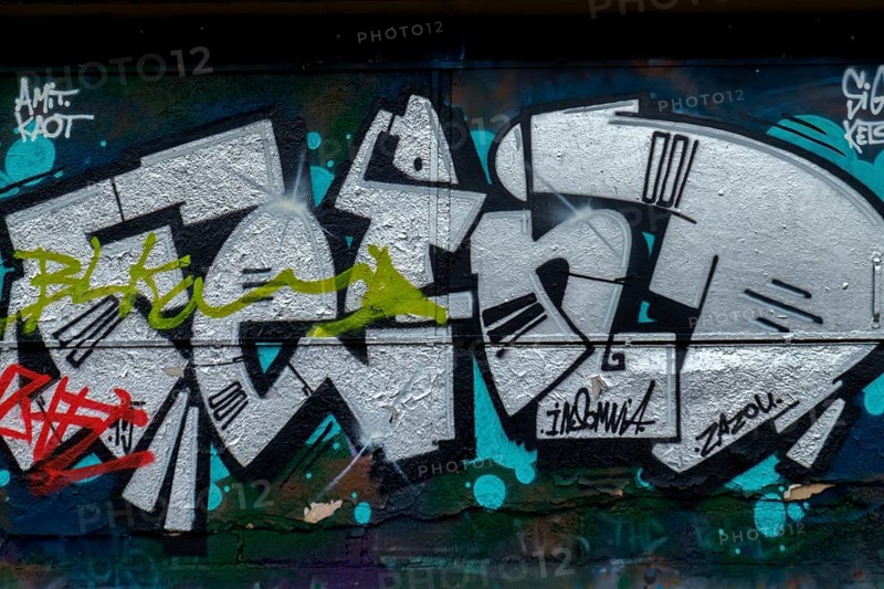 Black and white graffiti with green accents on a dark background, Landau, Rhineland-Palatinate, Germany, Europe