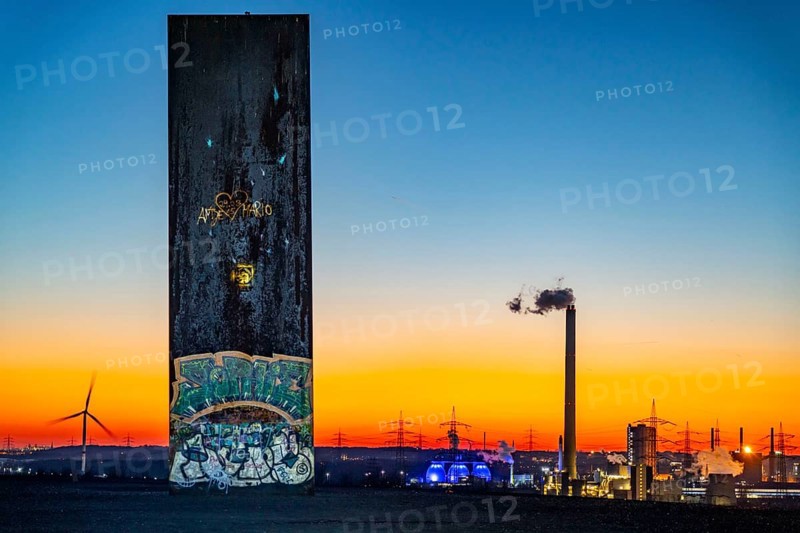 Sculpture by Richard Serra, slab for the Ruhr area on the Schurenbach slag heap, digesters of the Emscher sewage treatment plant in Bottrop, wind turbine, in Essen, Germany, Europe