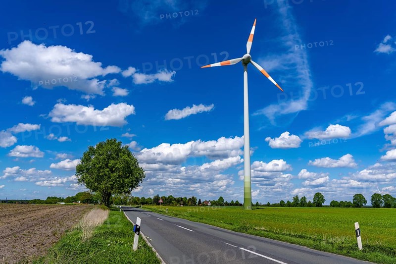 Wind turbine, wind energy plant from the manufacturer Enercon, blue sky with many white clouds, near Schermbeck, country road, Bestener Straße, North Rhine-Westphalia, Germany, Europe
